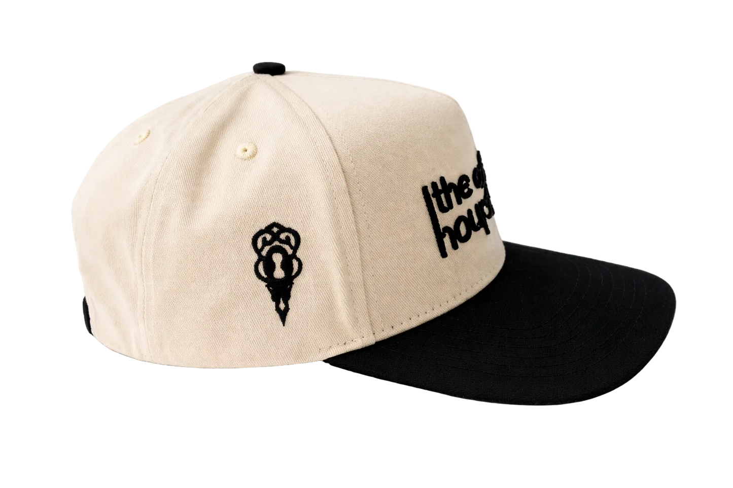 Beige and black cap with logo on a white background