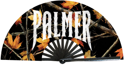 Handheld fan with 'Palmer' branding and autumn leaf design